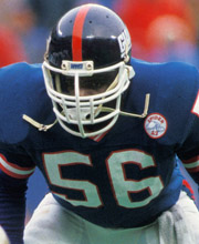 Pro Football Hall of Famer Lawrence Taylor wearing number 56 for the New York Giants playing linebacker