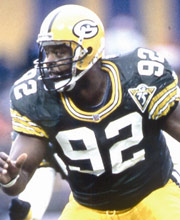 Pro Football Hall of Famer Reggie White wearing number 92 for the Green Bay Packers playing defensive end